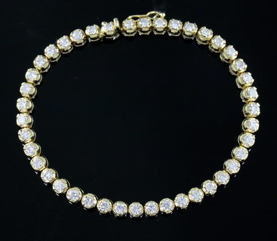 An Italian 18ct gold and diamond line bracelet, 18.3cm.